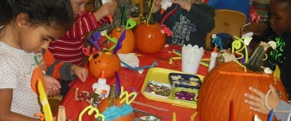 Pumpkin Decorating Fun being enjoyed by the children