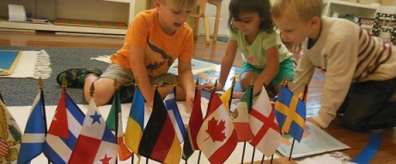 Children learning about new countries at the Open House